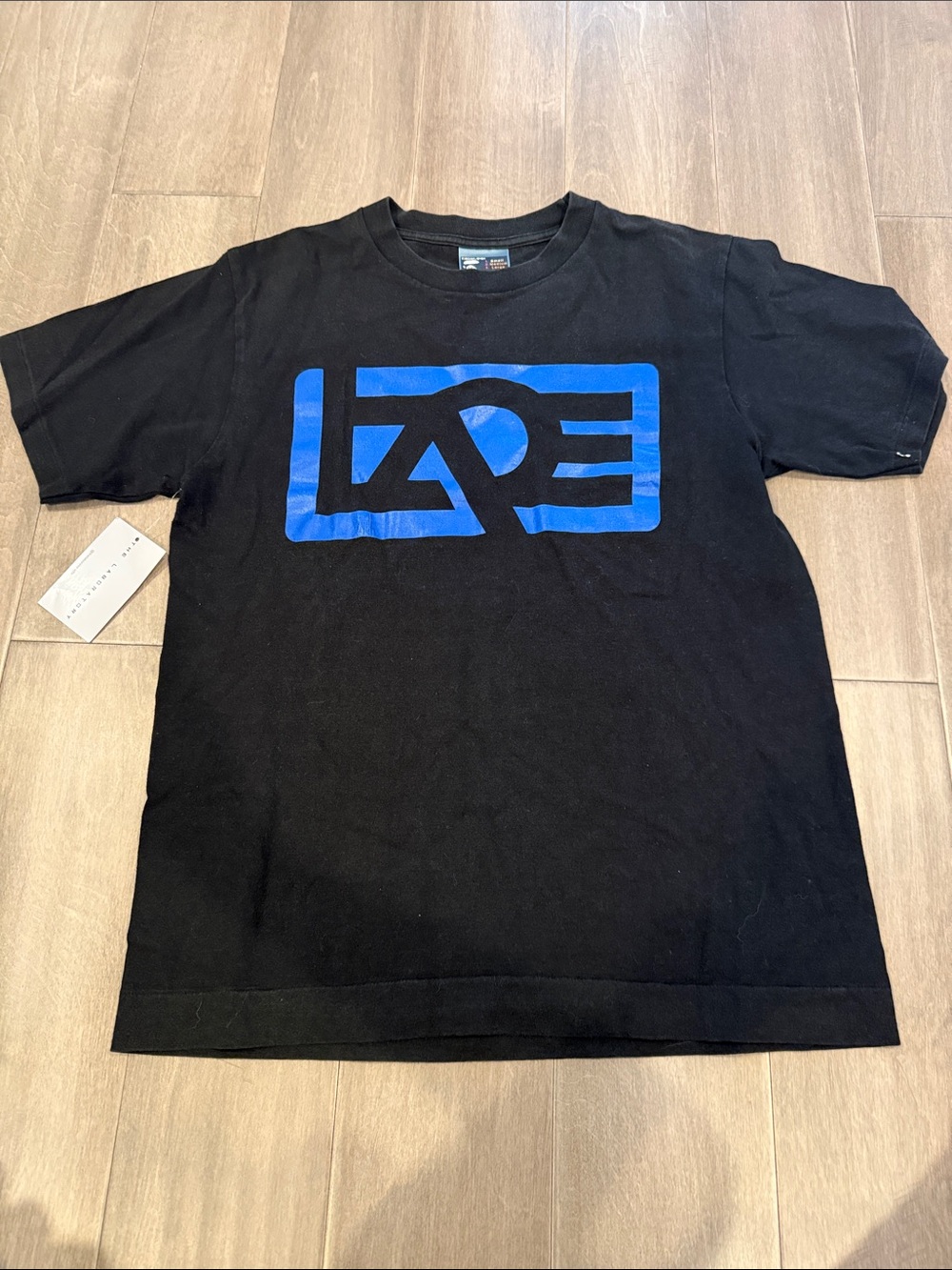 The Laundry Room Black T-Shirt with Blue Logo